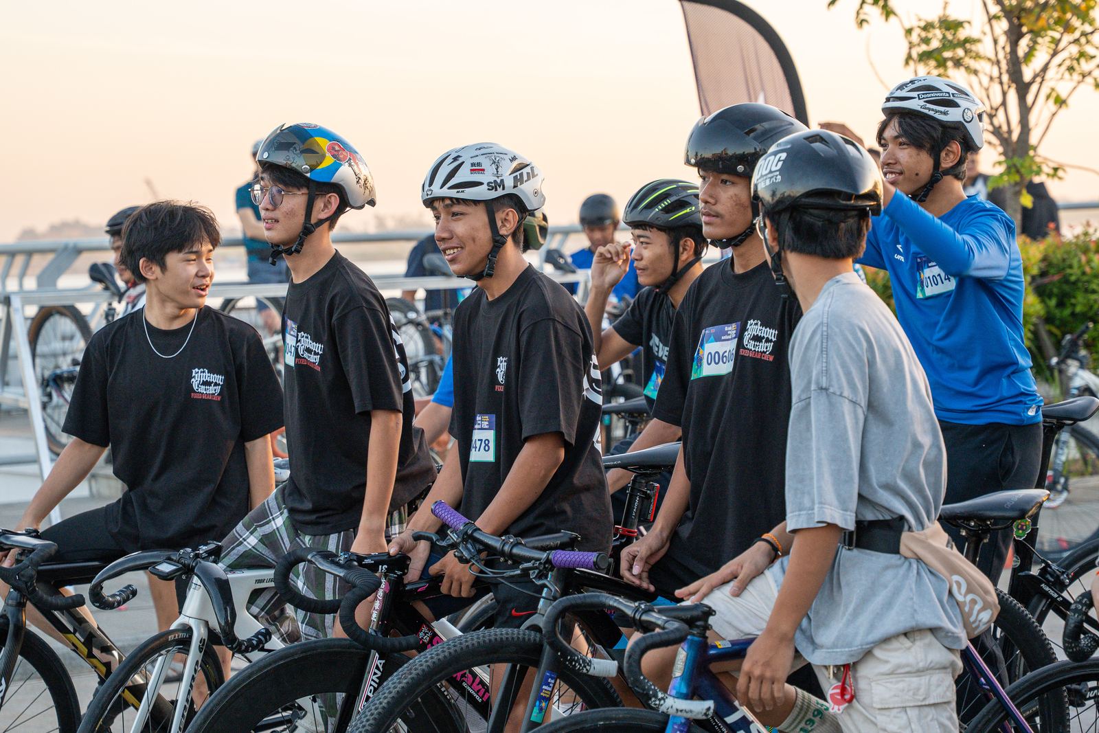 Young riders with helmets at the start