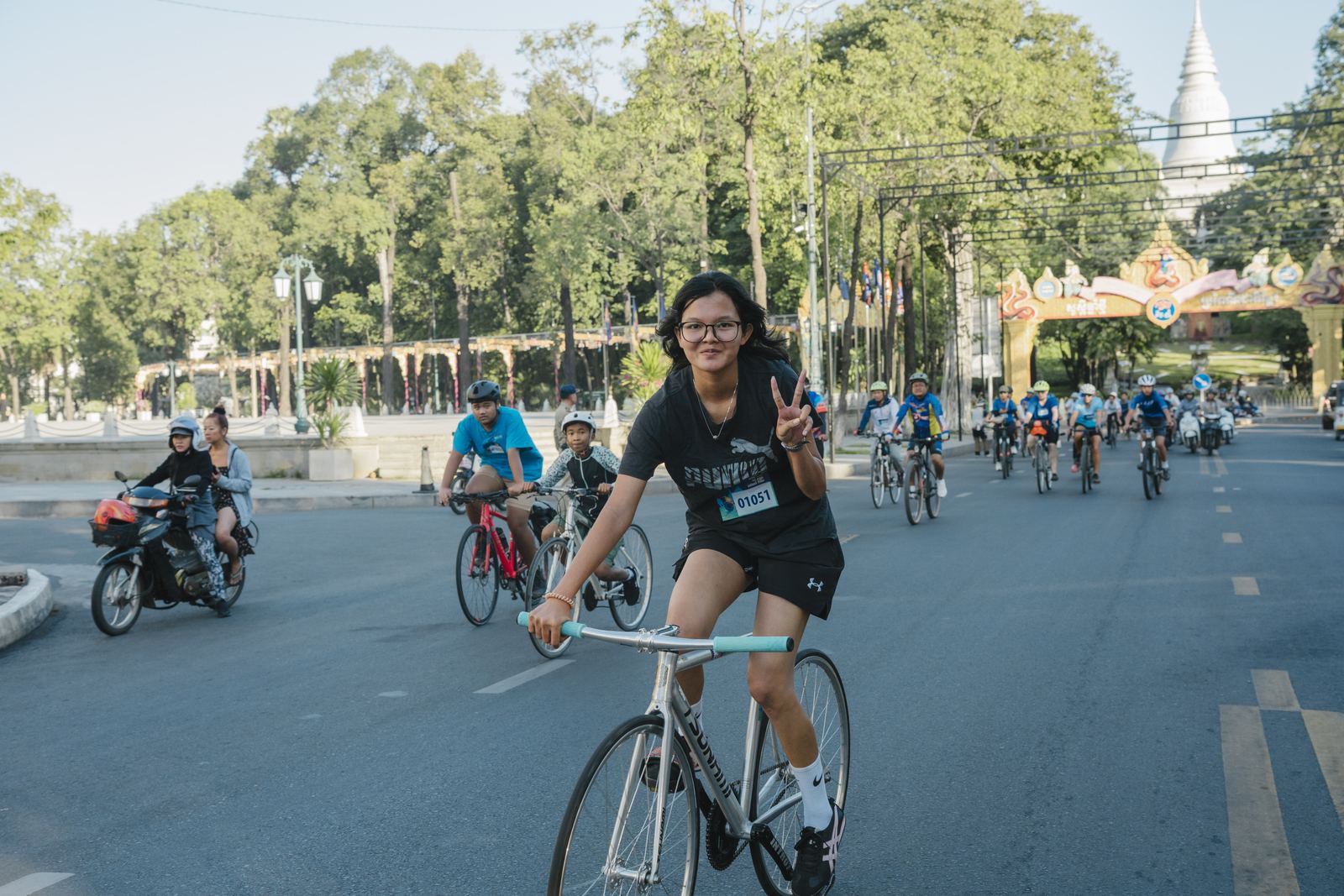 A rider waving on the route
