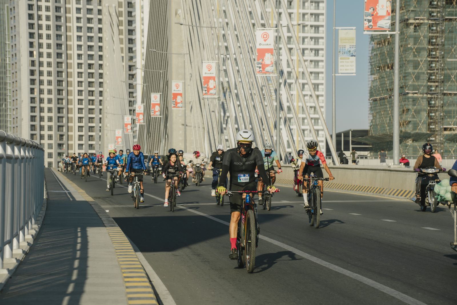 Riders crossing the bridge to Koh Pich
